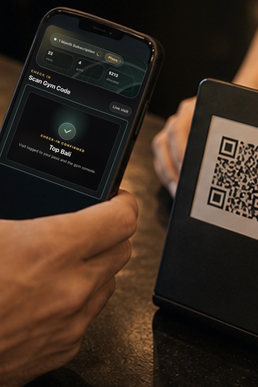 Iron Pass check-in confirmed on phone beside a gym QR code